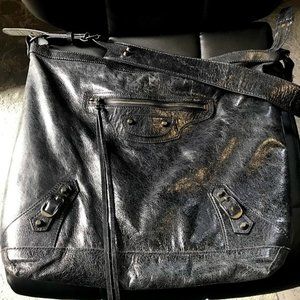 black leather hobo moto bag gunmetal silver hardware zippers studs tassels